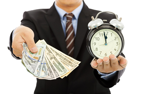 Businessman Holding Money And Clock